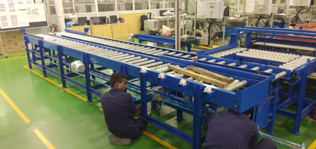 ROLLER CONVEYOR WITH CROSS TRANSFER BELT CONVEYORS Client: HITACHI ENERGY
