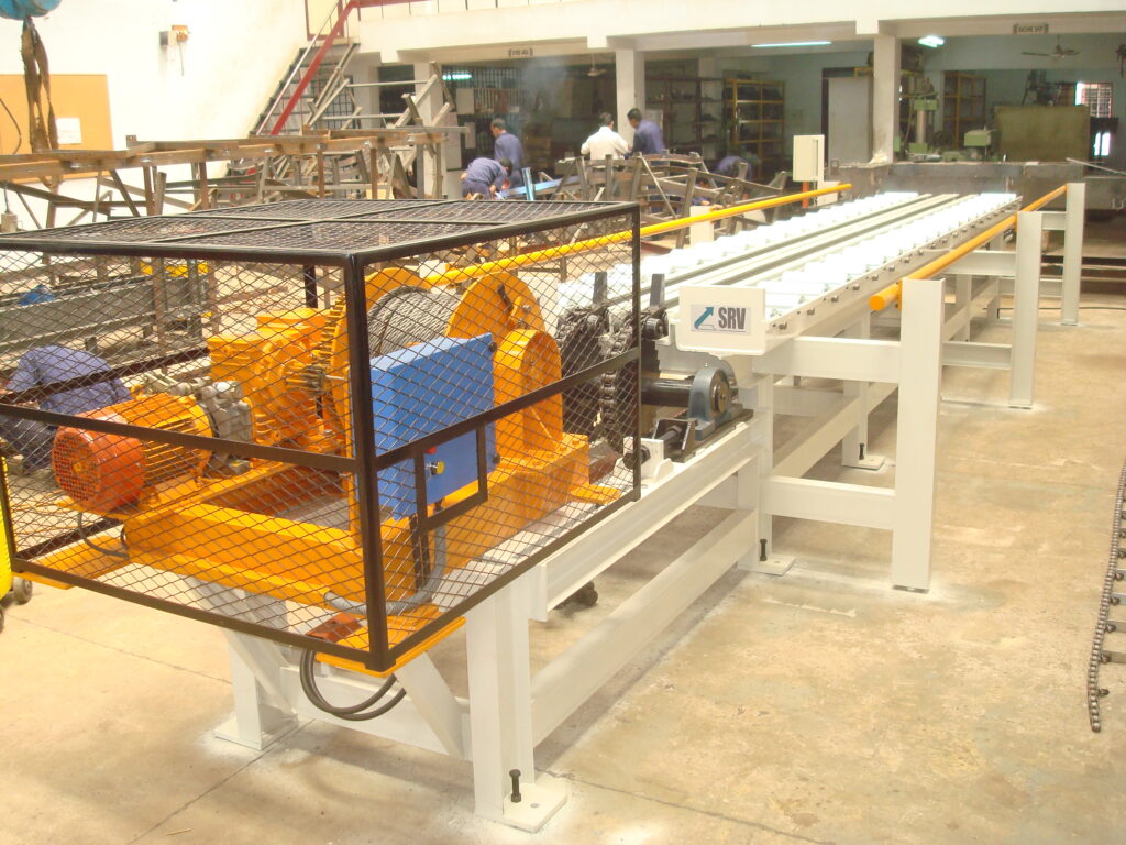 GRAVITY ROLLER CONVEYORS WITH MOTORISED PUSHER FOR DIE LOADING Client: AUTO PROFILE LTD